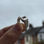 Image of Sam Ozanne Design's Silver Casio Ring Being Held