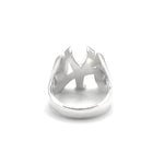 A silver NY New York Yankees ring with a sculptural, abstract crown-like top featuring sharp angular facets, shown on a plain white background.