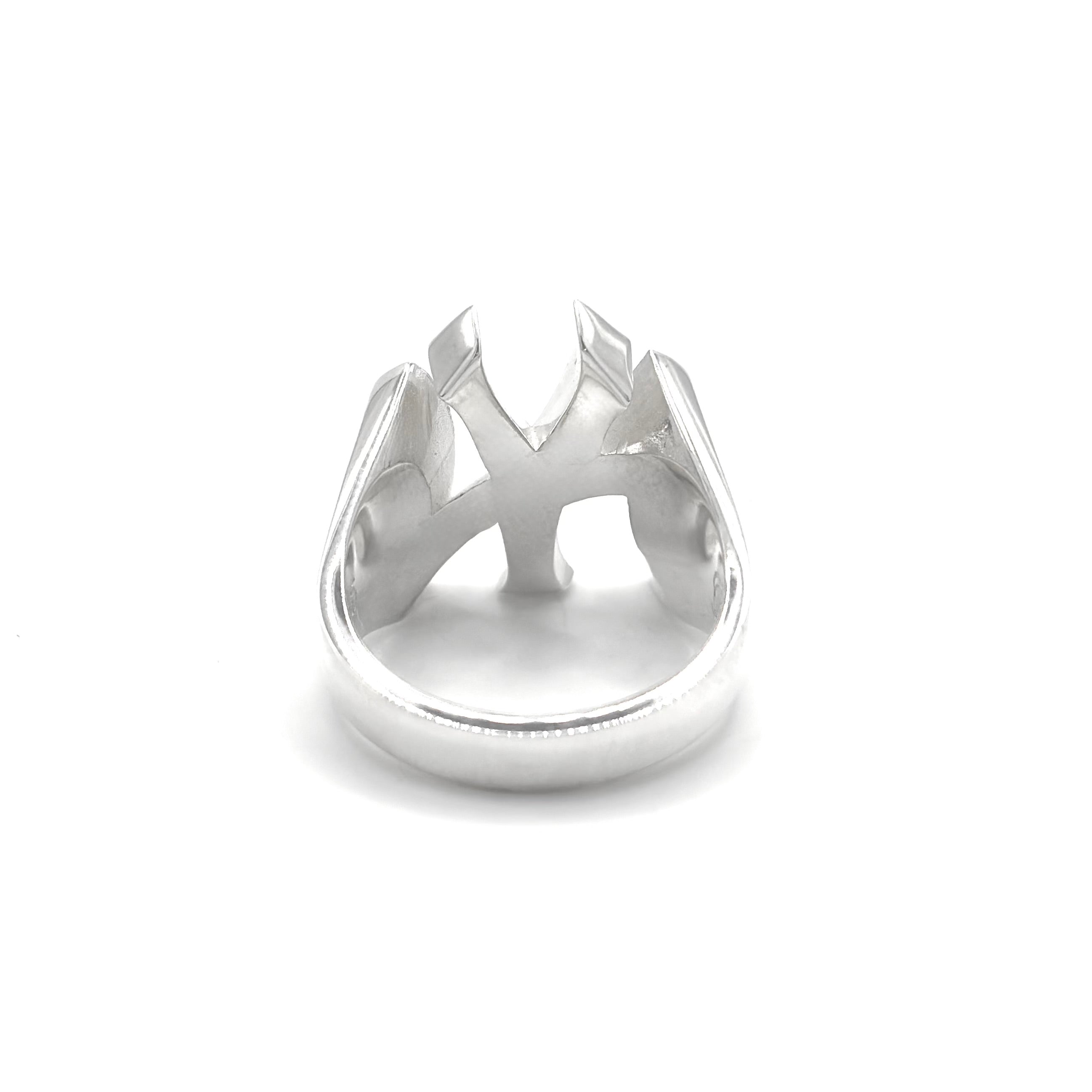 A silver NY New York Yankees ring with a sculptural, abstract crown-like top featuring sharp angular facets, shown on a plain white background.