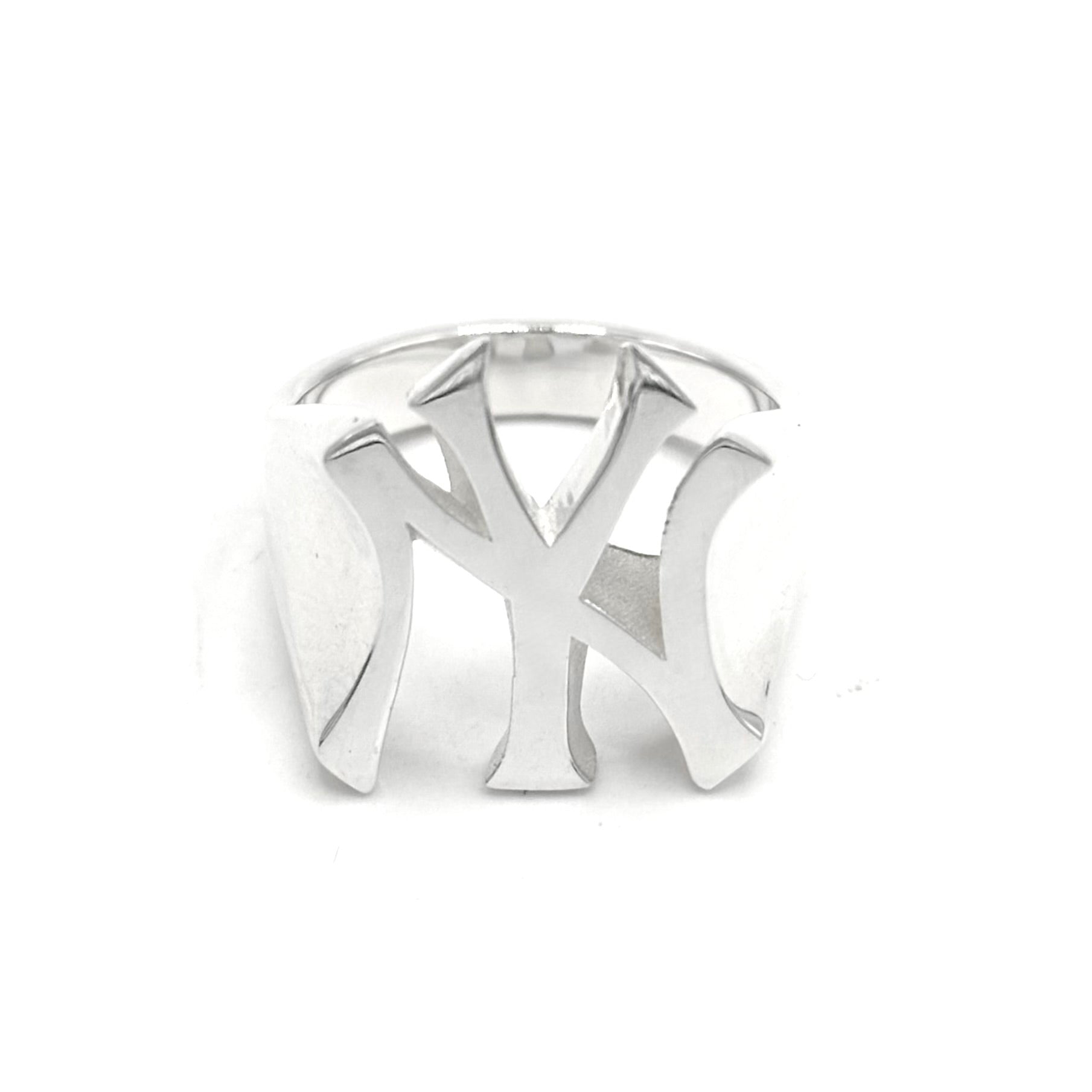 A silver-toned metal ring featuring a large, openwork interlocking 'NY' logo design, photographed on a seamless white background.