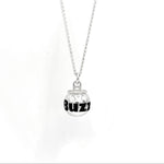 A silver chain necklace with a small cocktail can pendant featuring the word 'BuzzBallz' printed in bold black letters, shown against a plain white background.